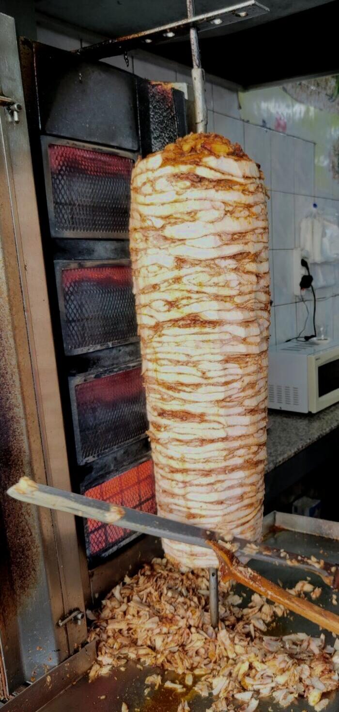 Chicken döner roasting on the vertical spit